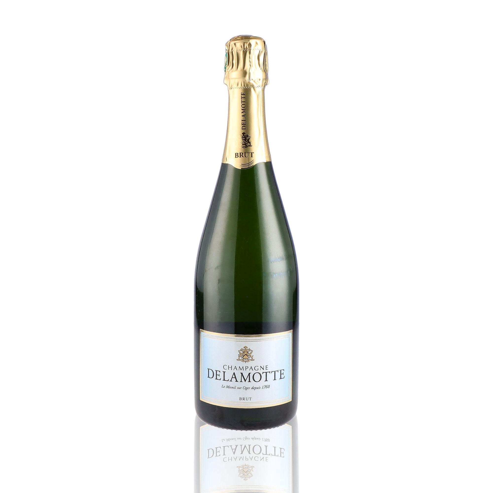 Une bouteille de champagne de la marque Delamotte, de type brut.