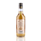 Une bouteille de rhum ambré, de la marque Damoiseau, nommée Cuvée du Distillateur.