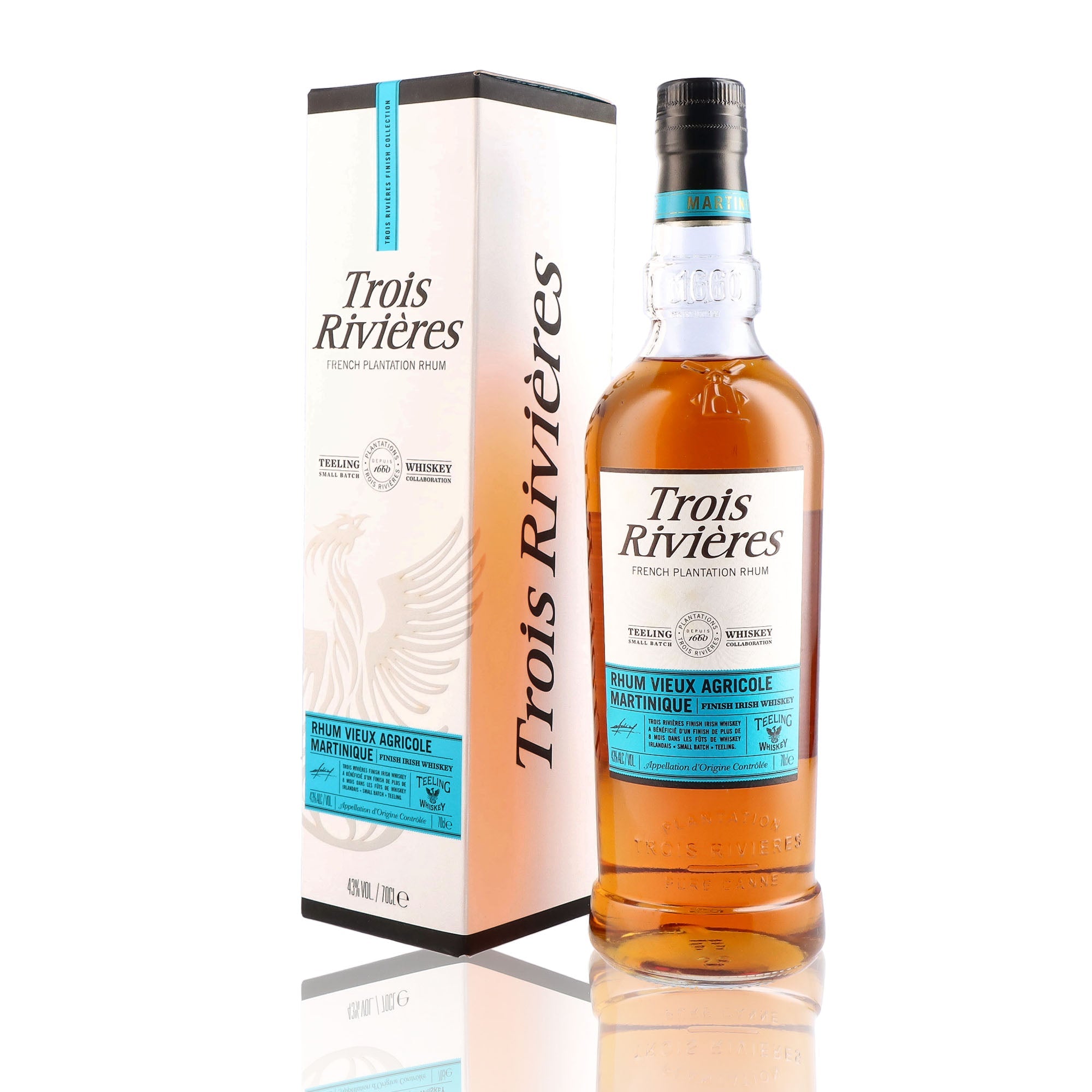 Une bouteille de rhum vieux, de la marque Trois Rivière, nommée Finish Irish Teeling Whiskey.