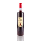 Une bouteille de Liqueur, de la marque Louis Roque, nommée Crème de Cassis .